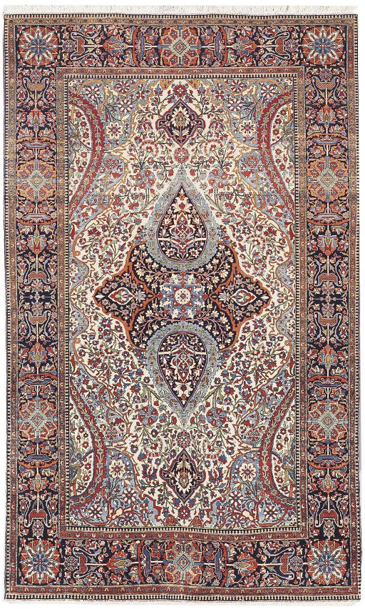 A Kashan Mohtasham rug, circa 1880: an ivory field with a graceful teardrop medallion in soft reds, blues and earth tones, finely drawn floral vinework, framed by an indigo border