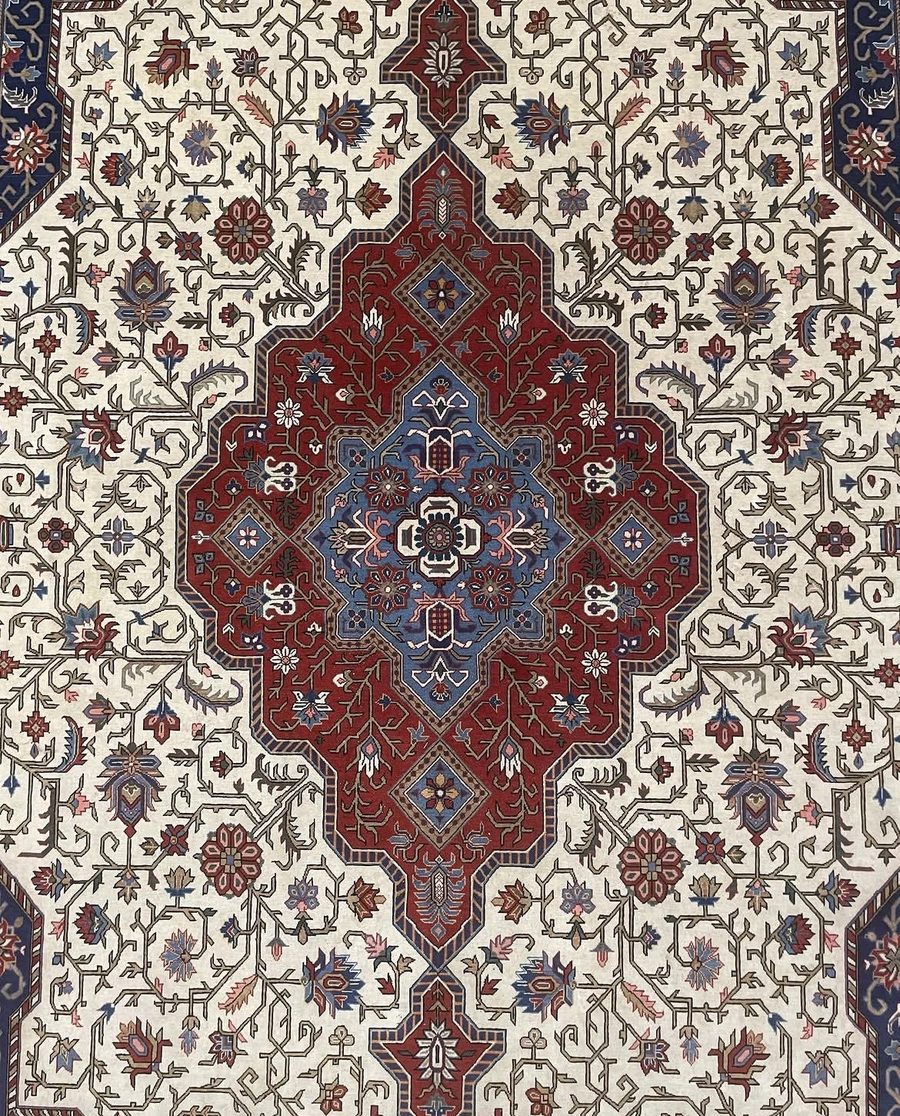 Centre medallion of a Qom carpet attributed to Rashtizadeh, ivory field with red and blue lachak-toranj, from the Gereh & Naqsh collection