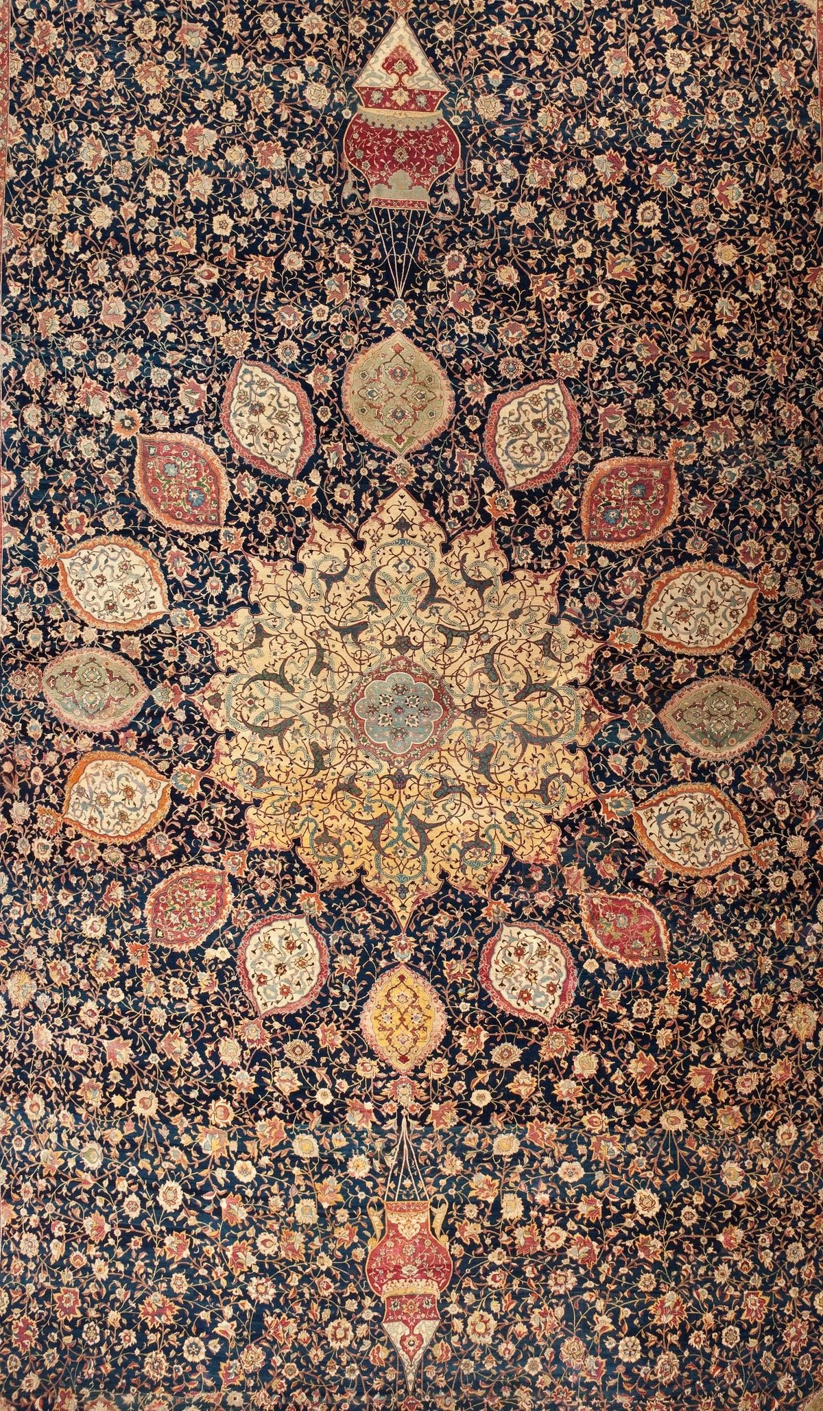 The Los Angeles Ardabil: the same sunburst medallion and pendants on indigo, the field running nearly to the edge where the original borders were removed.