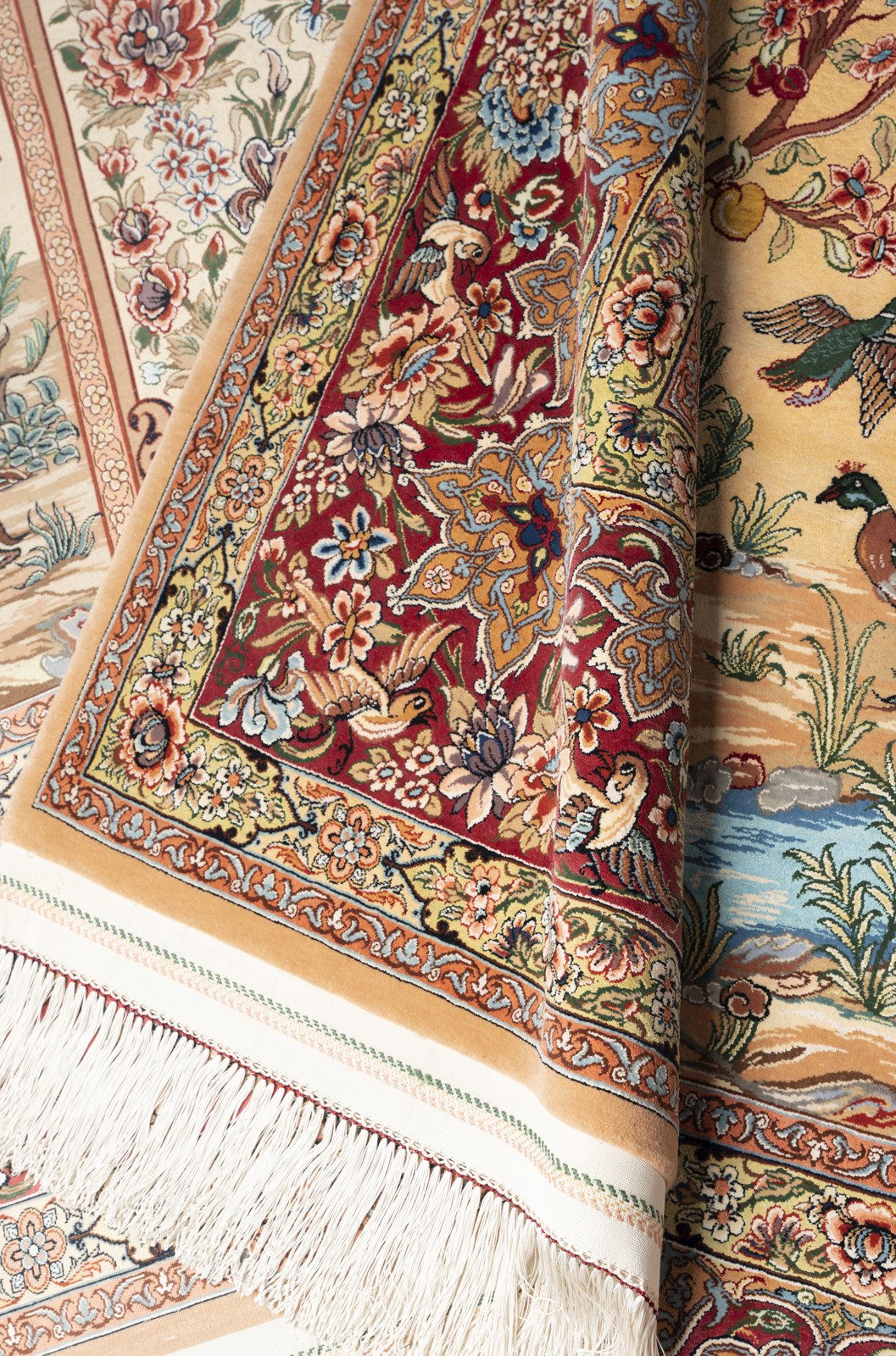 The two carpets of the pair shown together, matched in drawing and colour across the design.