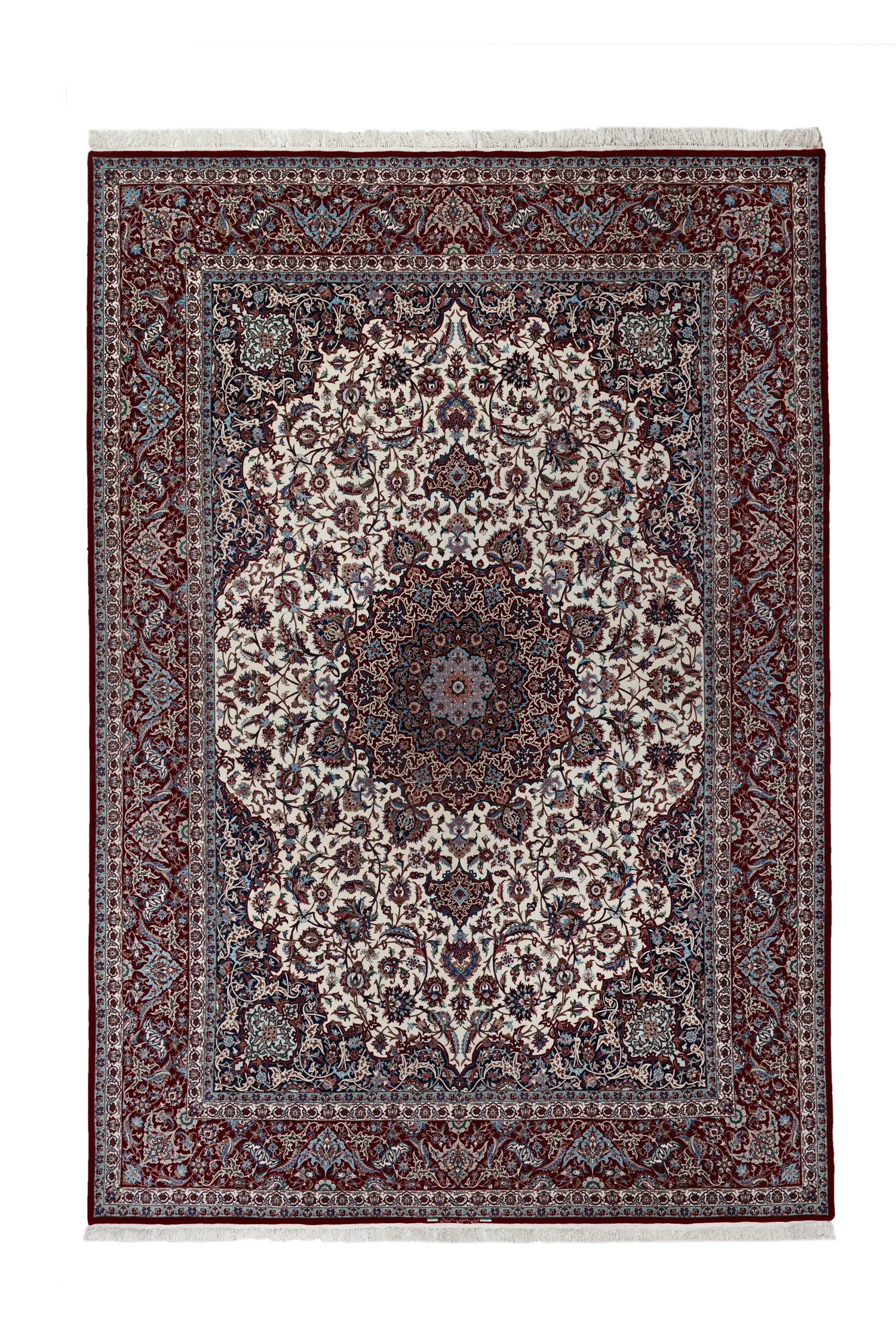 A large star-medallion Isfahan carpet by Ahmad Zojaji: an ivory field of dense Shah Abbasi flora around a red-and-navy star medallion, navy corner medallions, and a deep wine border, the white silk fringes visible at both ends.